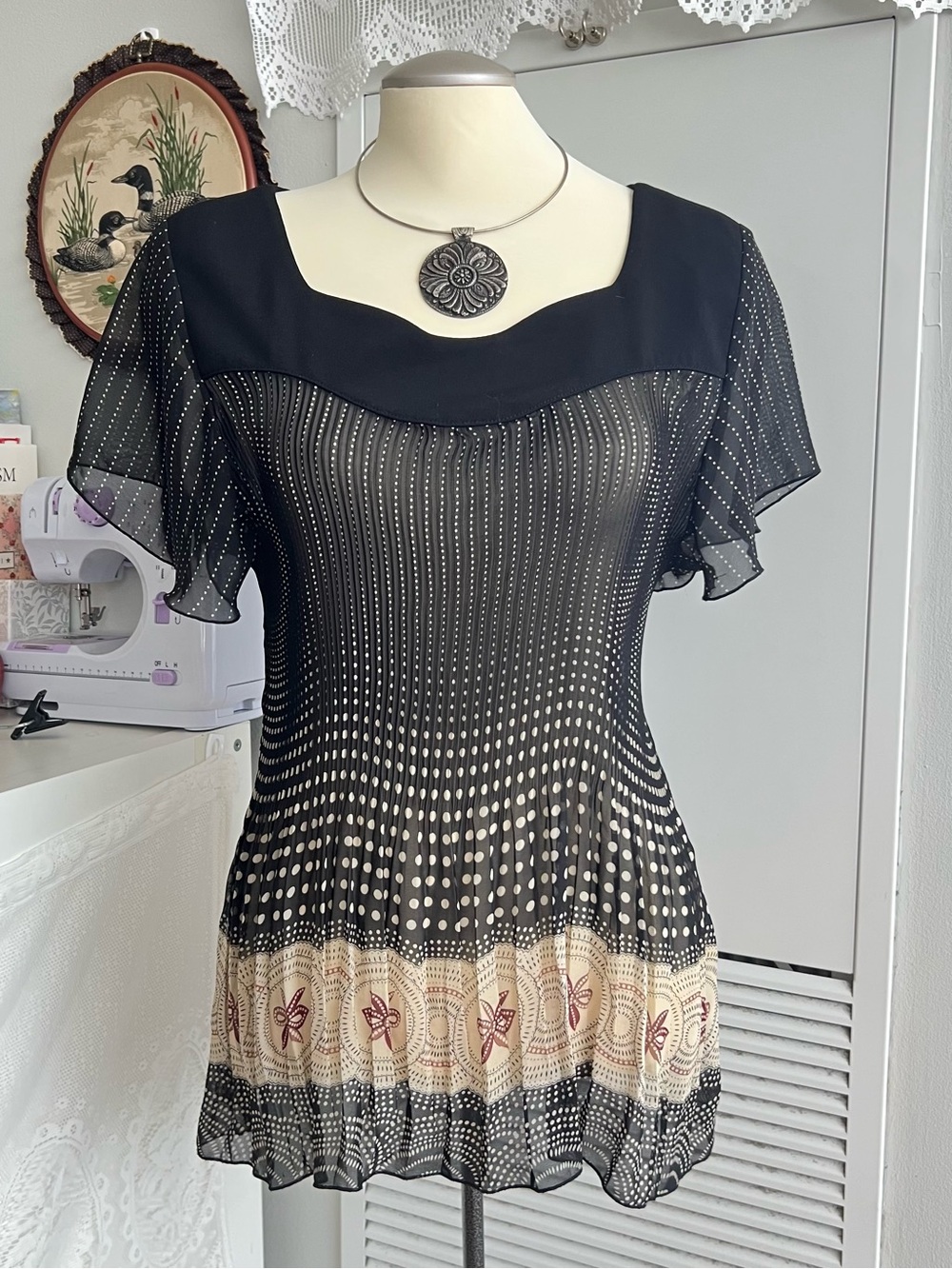 George Y2K style sheer black and cream polka dot blouse